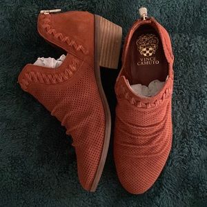 Vince Camuto perforated suede booties in cayenne